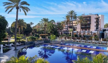 Outdoor pool, open 10:30 AM to 5:30 PM, pool umbrellas, sun loungers