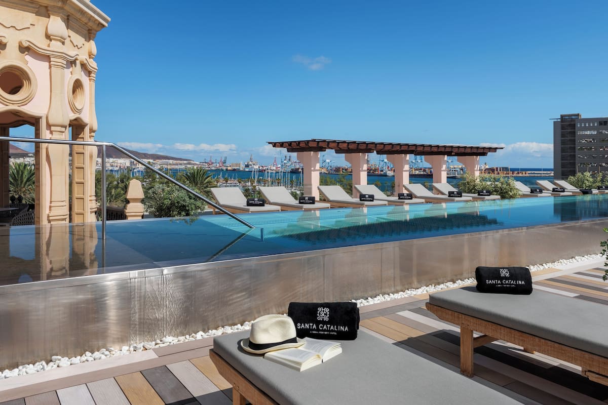 outdoor pool, open 10:30 am to 5:30 pm, pool umbrellas, pool loungers