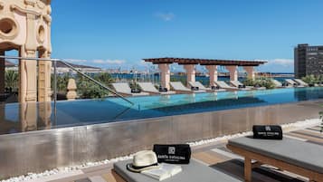 Outdoor pool, open 10:30 AM to 5:30 PM, pool umbrellas, pool loungers