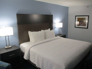 Premium bedding, pillow-top beds, desk, laptop workspace