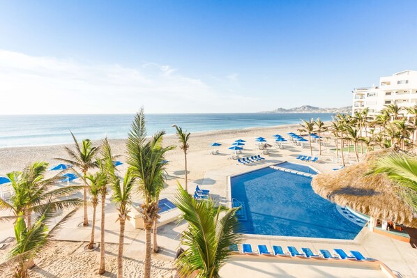 Outdoor pool, pool umbrellas, sun loungers