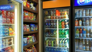 A vending machine area with various snacks and drinks.