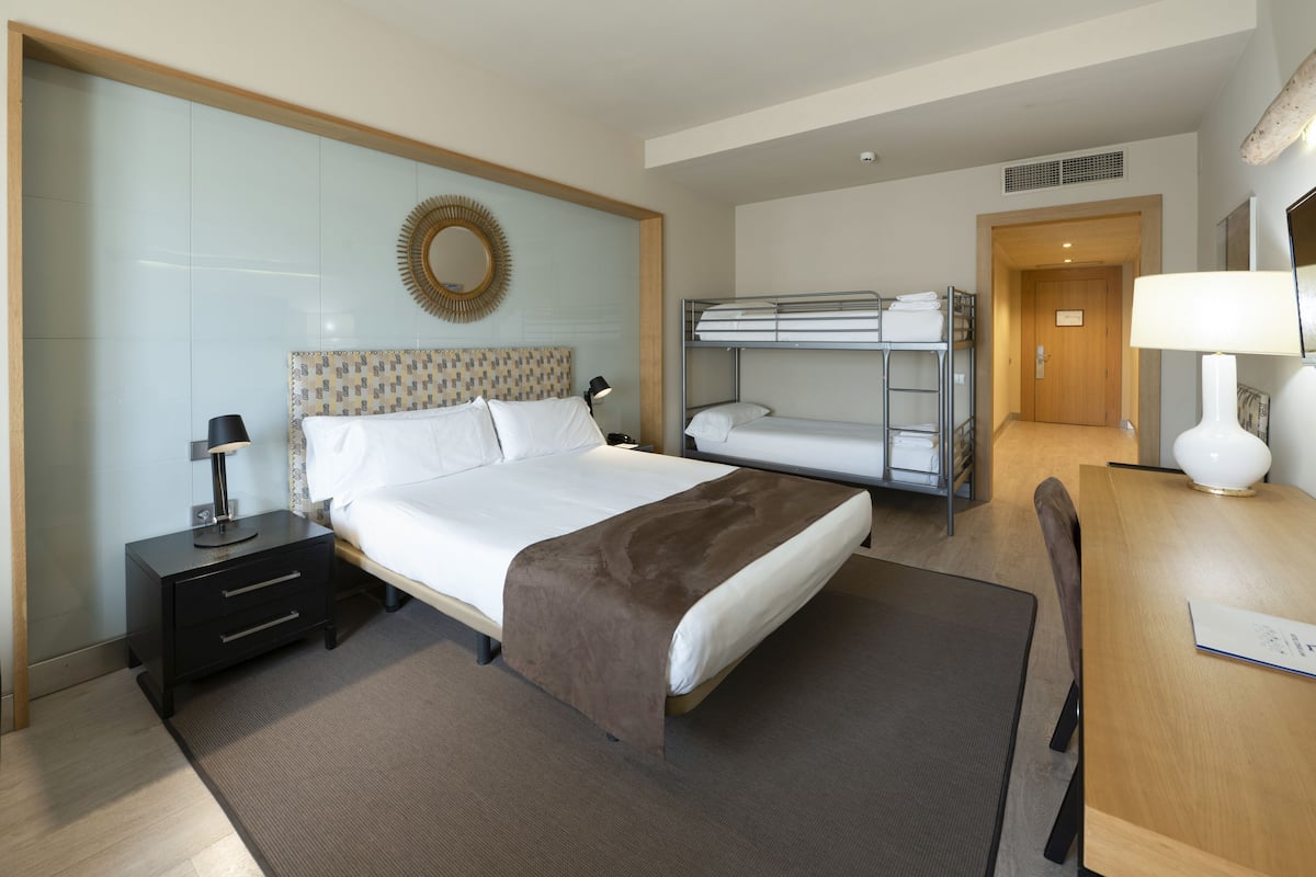 Family Room | 1 bedroom, premium bedding, minibar, in-room safe