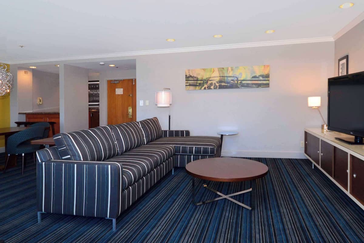Presidential Suite, 1 King Bed | Living area | 55-inch flat-screen TV with cable channels