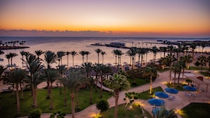 A resort with a beachfront view, palm trees, and a pier. - Continental Hotel Hurghada (Hurghada)