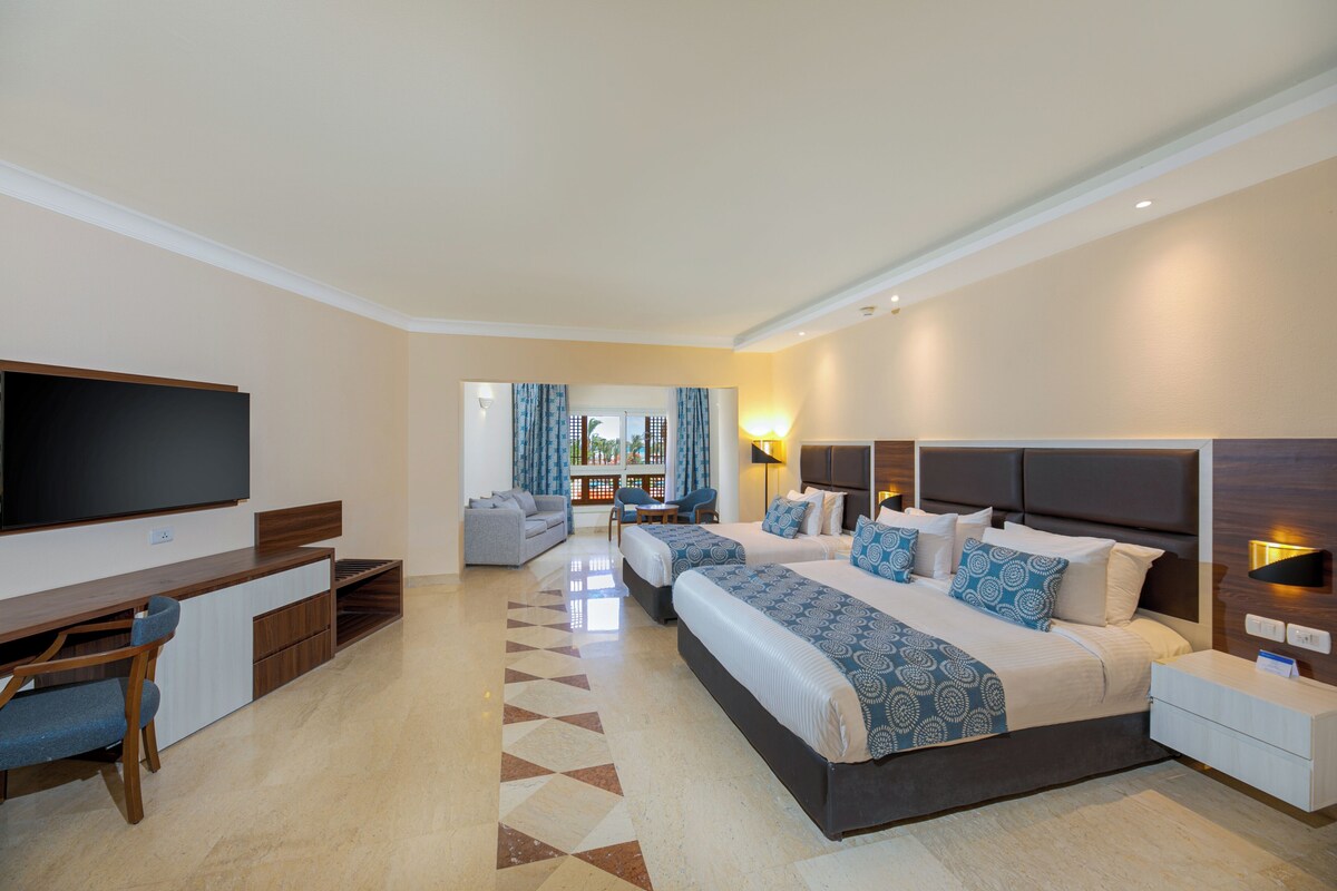 Family Room, Partial Sea View | Pillowtop beds, in-room safe, iron/ironing board, WiFi (free)