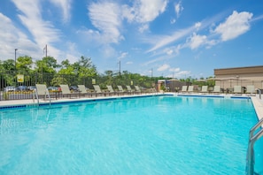 Seasonal outdoor pool, open 11:00 AM to 7:00 PM, pool loungers