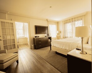 Relax in comfort with a large bed, flat-screen TV, and convenient storage.
