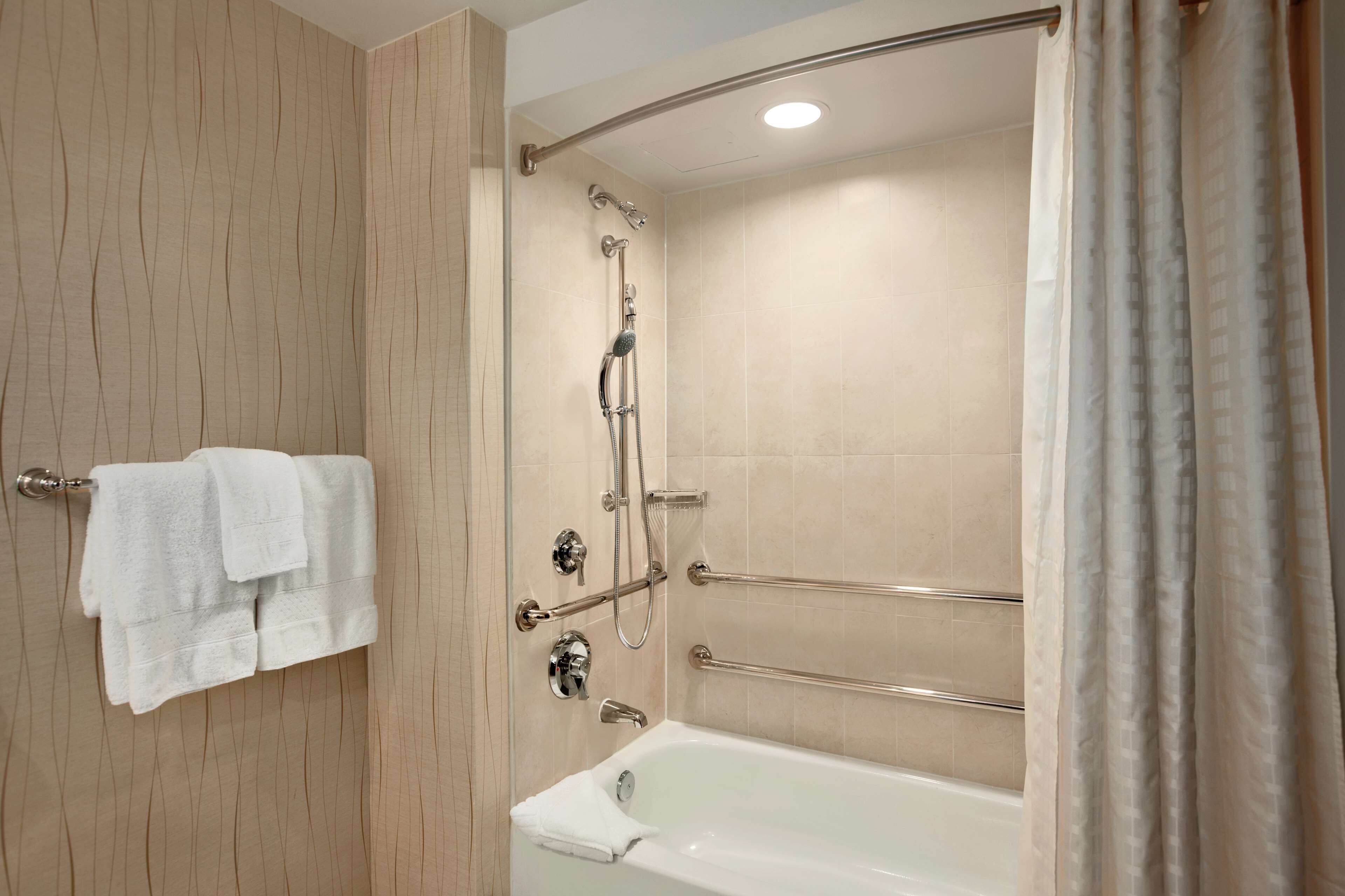 combined shower/bathtub, designer toiletries, hair dryer, bathrobes