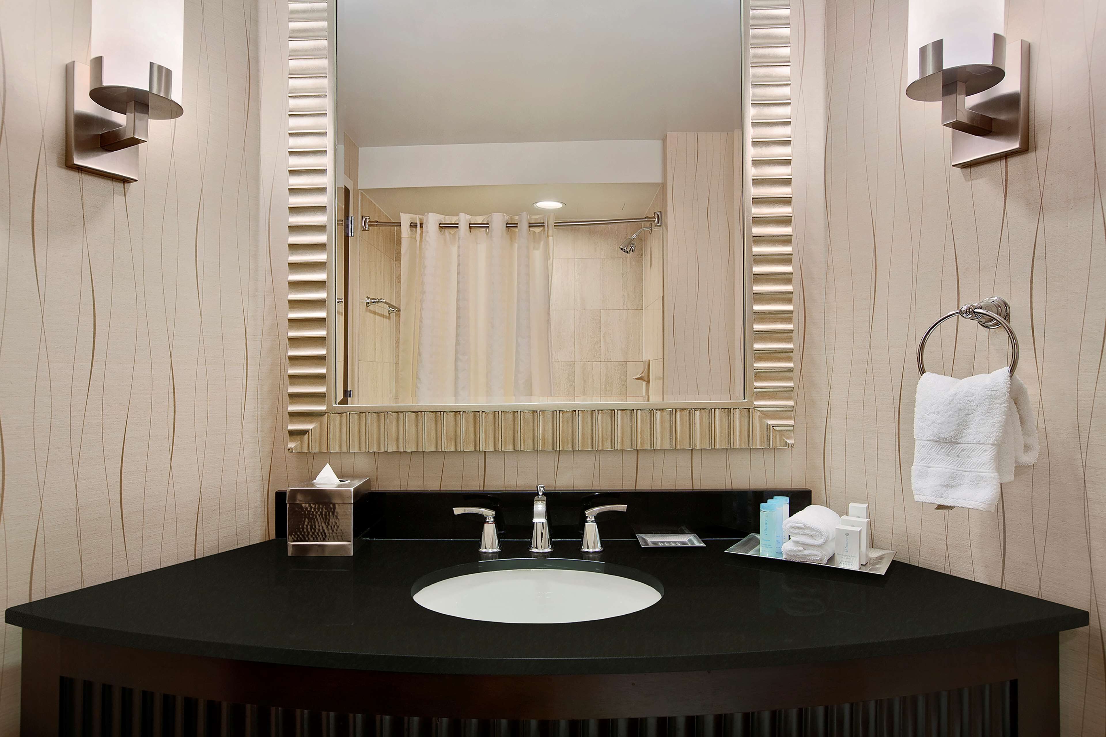 combined shower/bathtub, designer toiletries, hair dryer, bathrobes