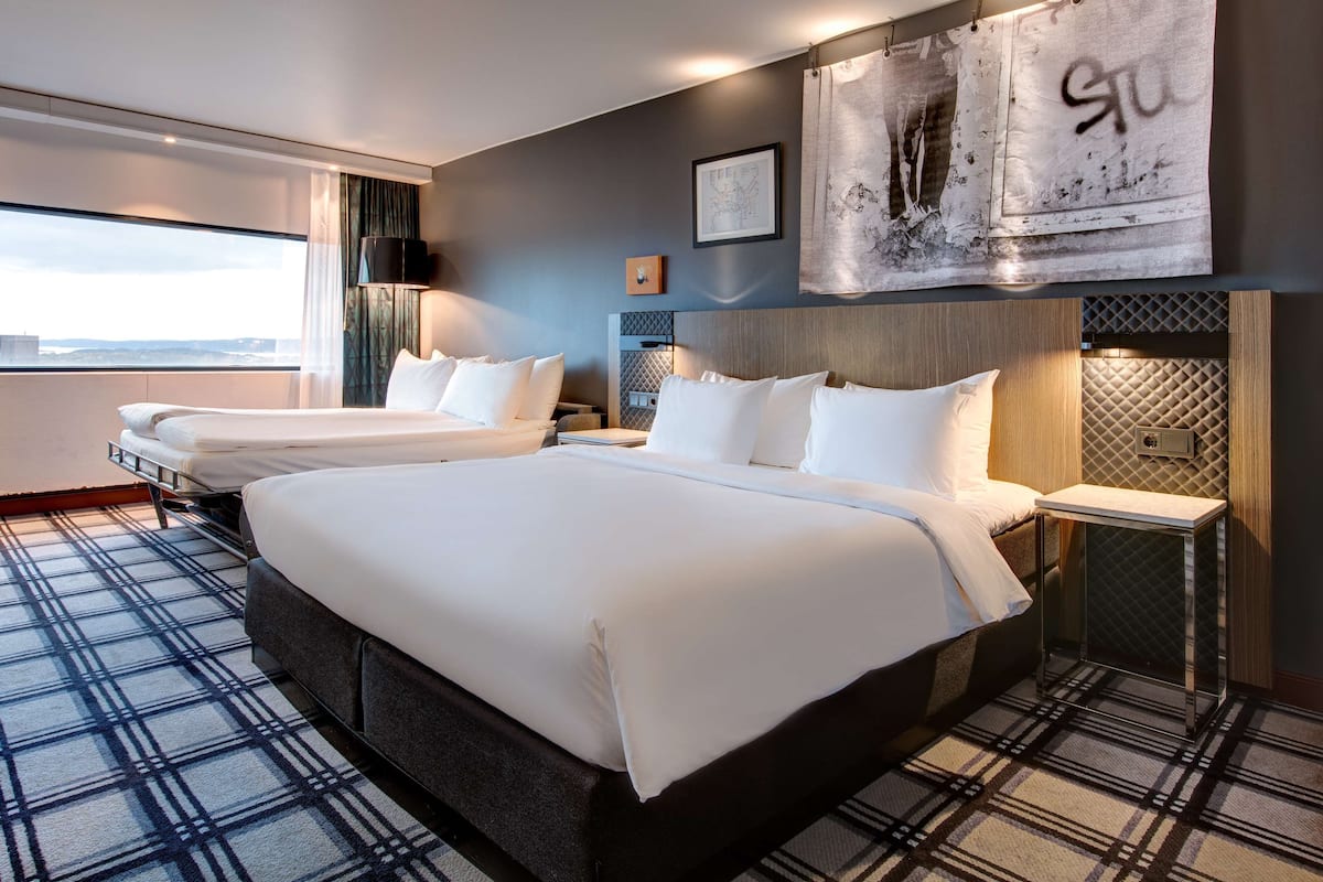 Premium bedding, down comforters, pillowtop beds, in-room safe