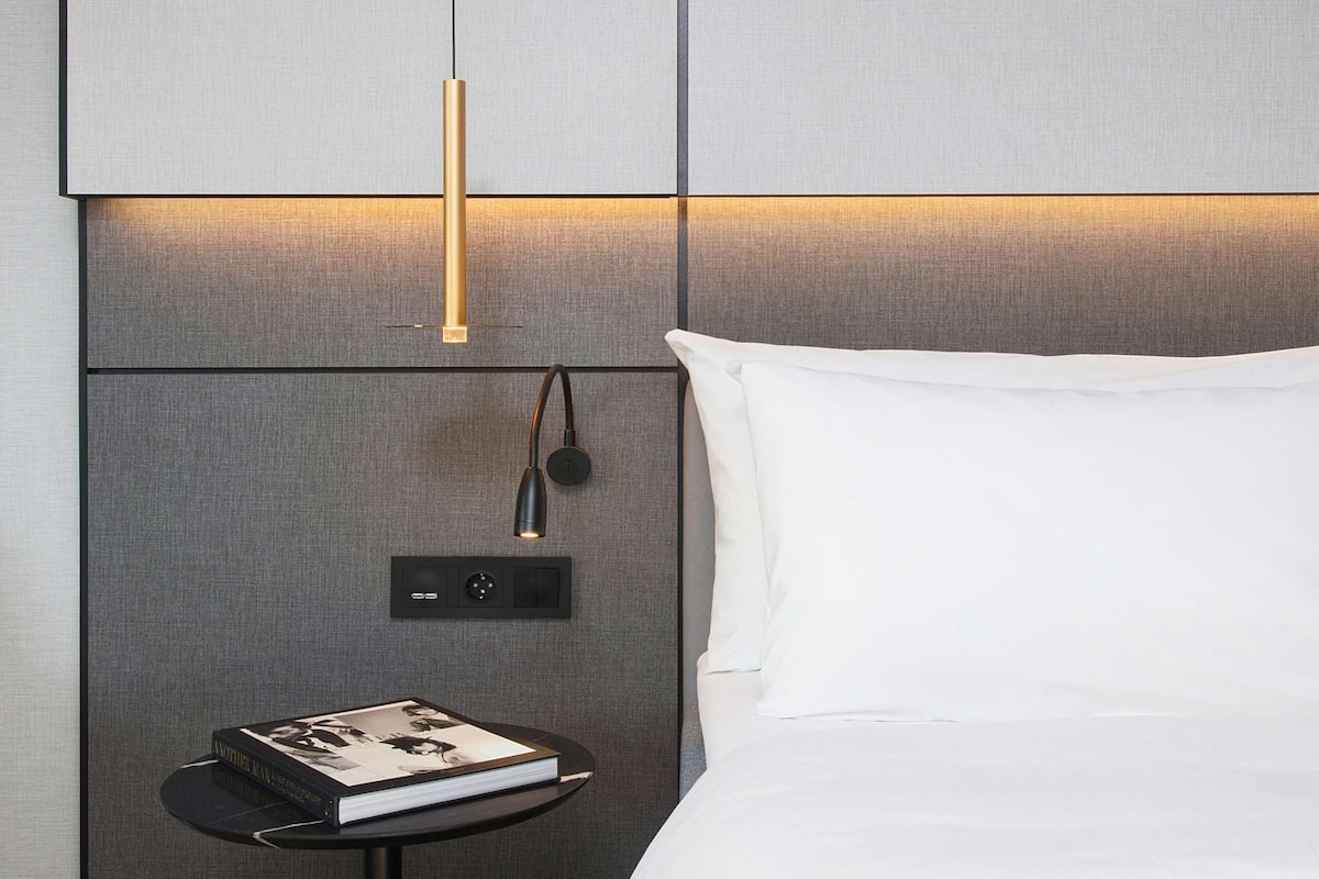 Premium bedding, down comforters, pillowtop beds, in-room safe