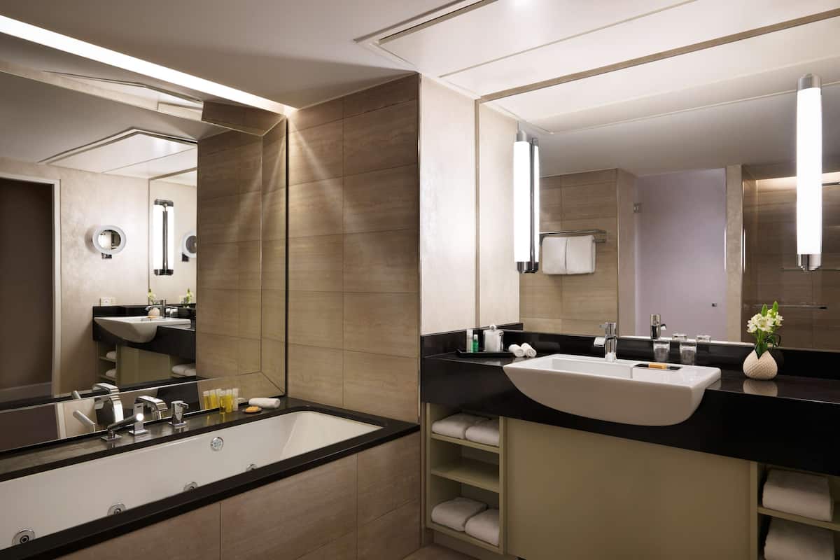 executive suite | bathroom | separate bathtub and shower, hair dryer, bathrobes, slippers