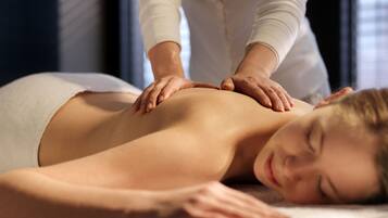 A person receiving a back massage.