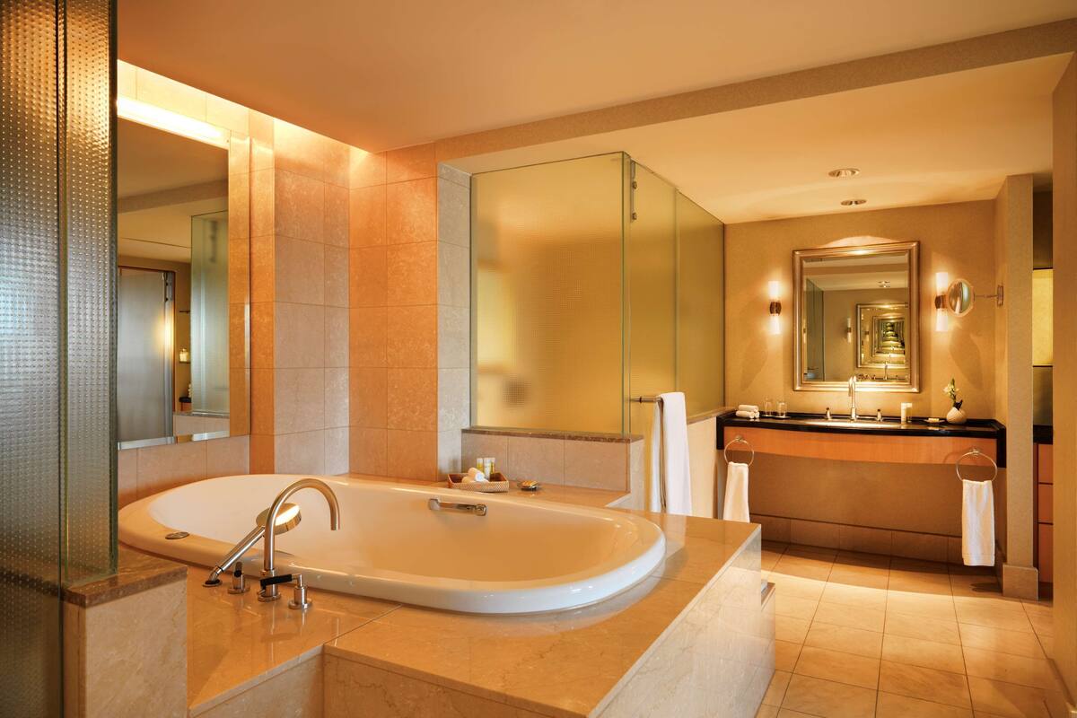 separate bathtub and shower, hair dryer, bathrobes, slippers