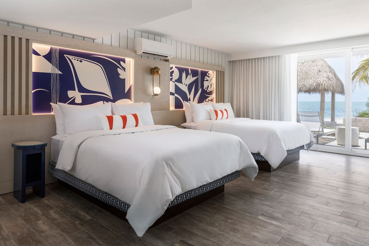 Guest Room, 1 King and 2 Queens, Oceanview Lanai | 1 bedroom, in-room safe, individually decorated, individually furnished