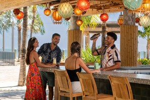 3 bars/lounges, poolside bar, beach bar