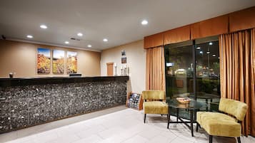 Welcome to our reception area, featuring a stylish desk and comfortable seating for guests.