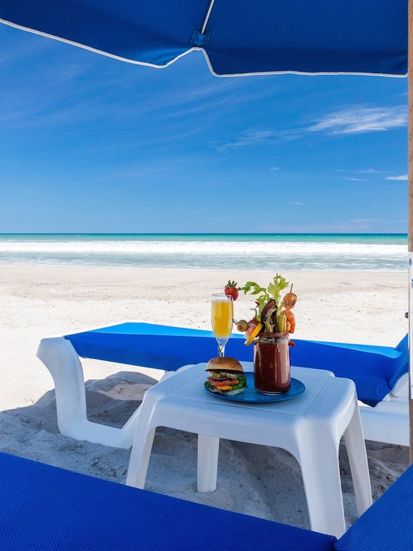 On the beach, sun loungers, beach umbrellas, beach towels