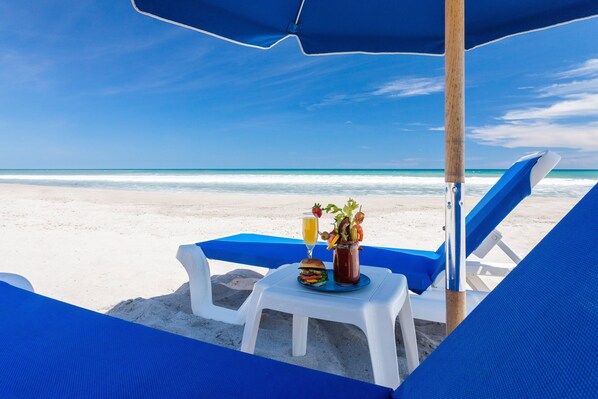 On the beach, sun loungers, beach umbrellas, beach towels