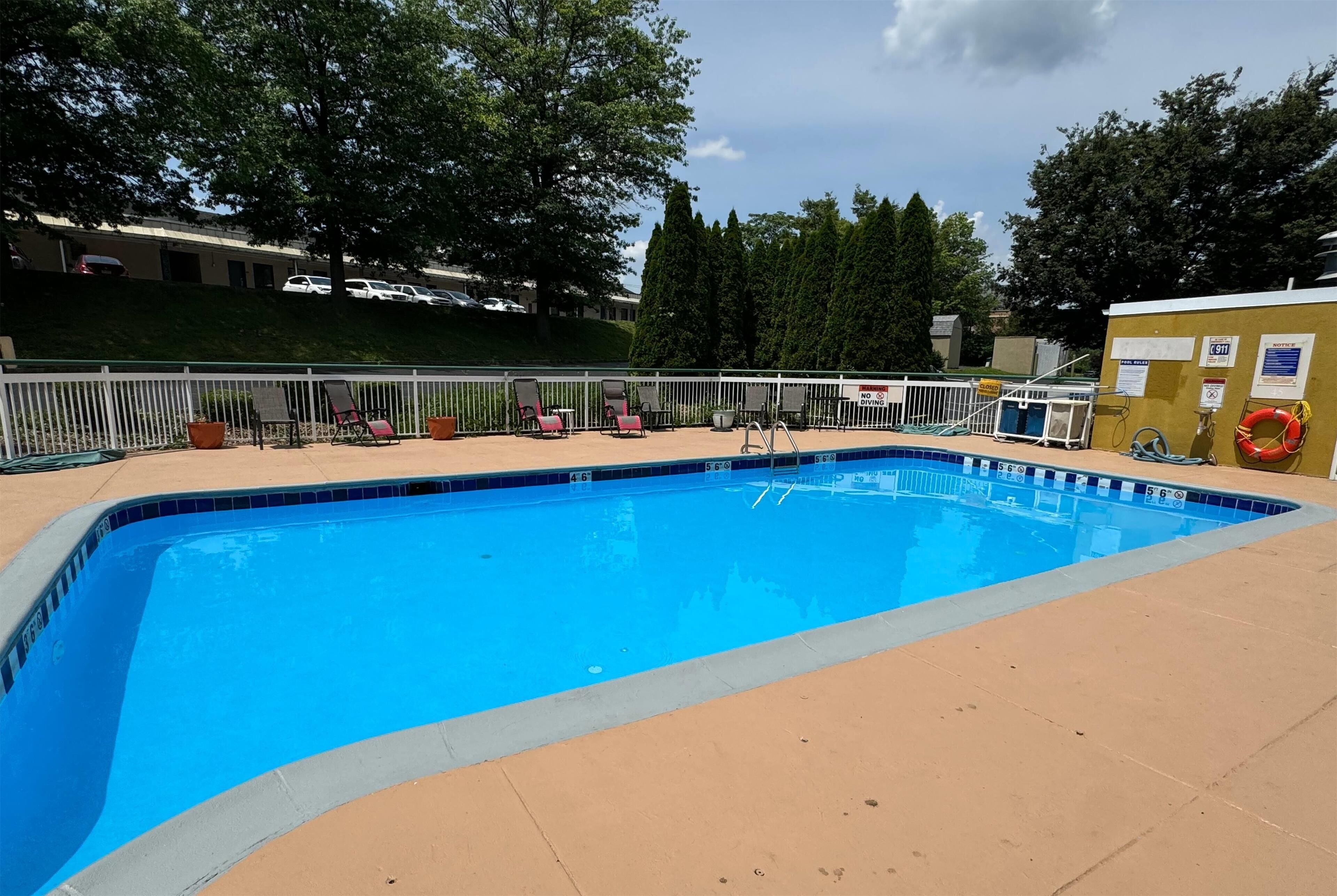 Seasonal outdoor pool, open 7:00 AM to 9:00 PM, pool loungers
