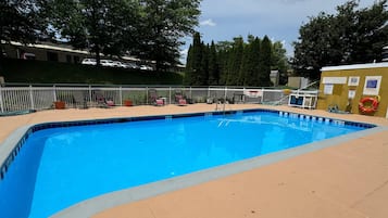 Seasonal outdoor pool, open 7:00 AM to 9:00 PM, pool loungers