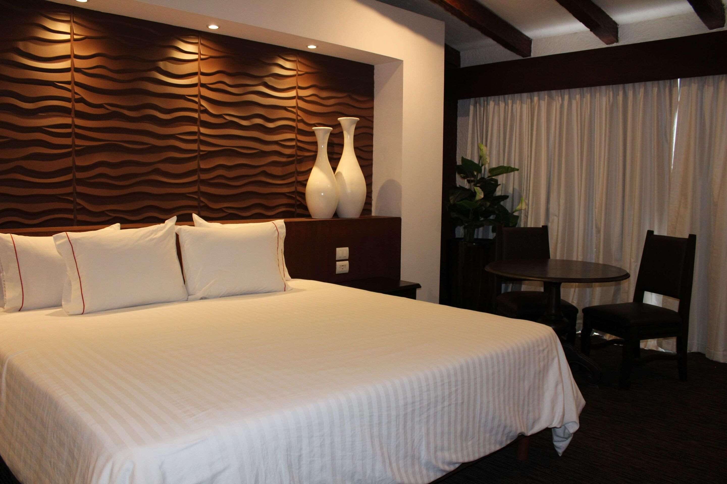 premium room, 1 king bed, non smoking | in-room safe, desk, iron/ironing board, free cots/infant beds