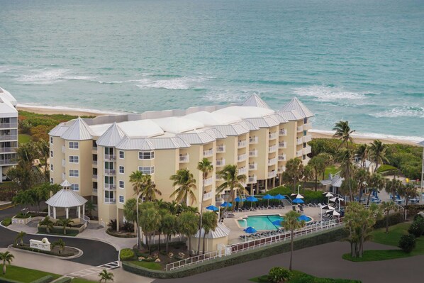 Enjoy a refreshing dip in the pool surrounded by lush gardens and ocean views.