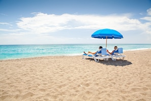On the beach, white sand, beach towels