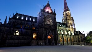 A large Gothic-style cathedral with intricate architecture and illuminated windows. - ibis Styles Linz (Linz)