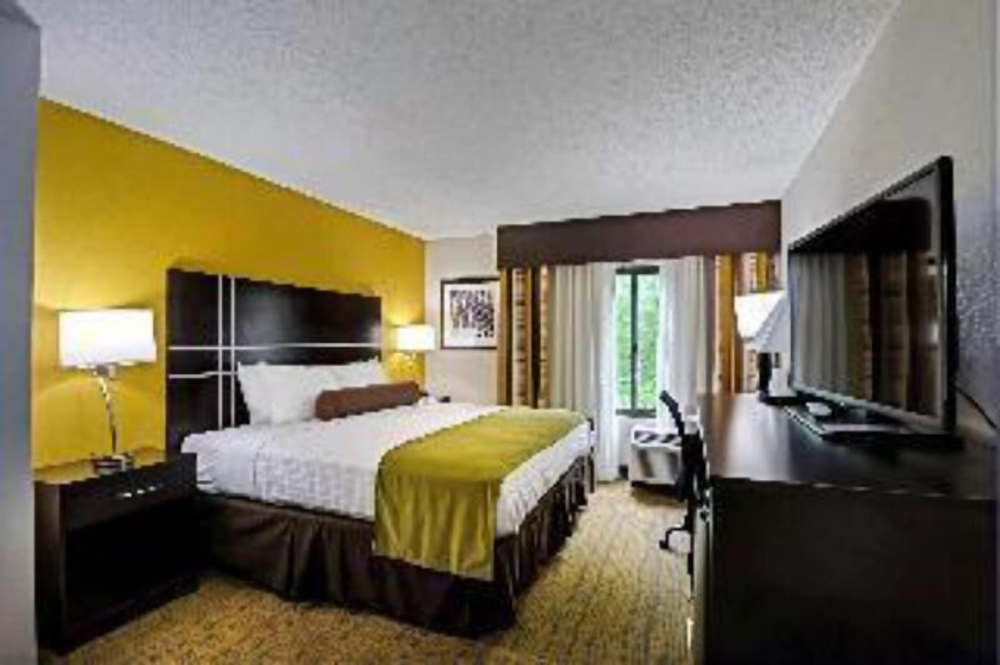 Premium bedding, desk, laptop workspace, soundproofing