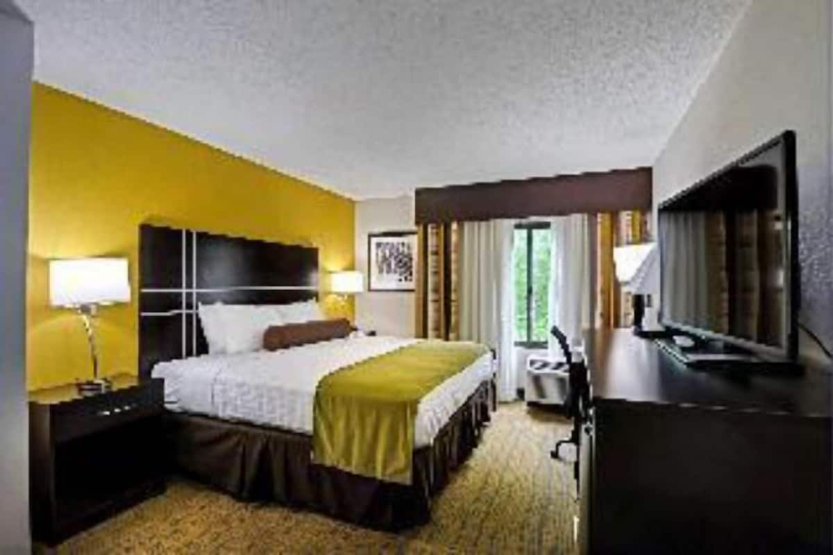 Premium bedding, desk, laptop workspace, soundproofing