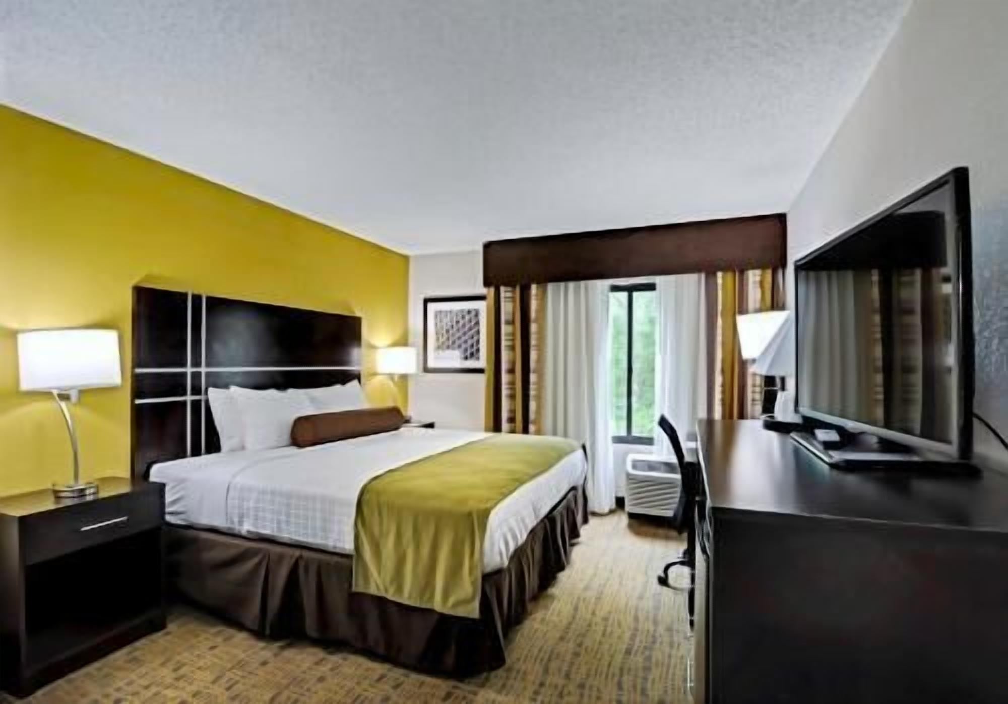 Premium bedding, desk, laptop workspace, soundproofing