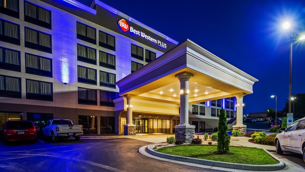 A Best Western Plus hotel with a covered entrance, multiple floors, and a parking area. - Best Western Plus Hanes Mall Hotel (Winston-Salem)