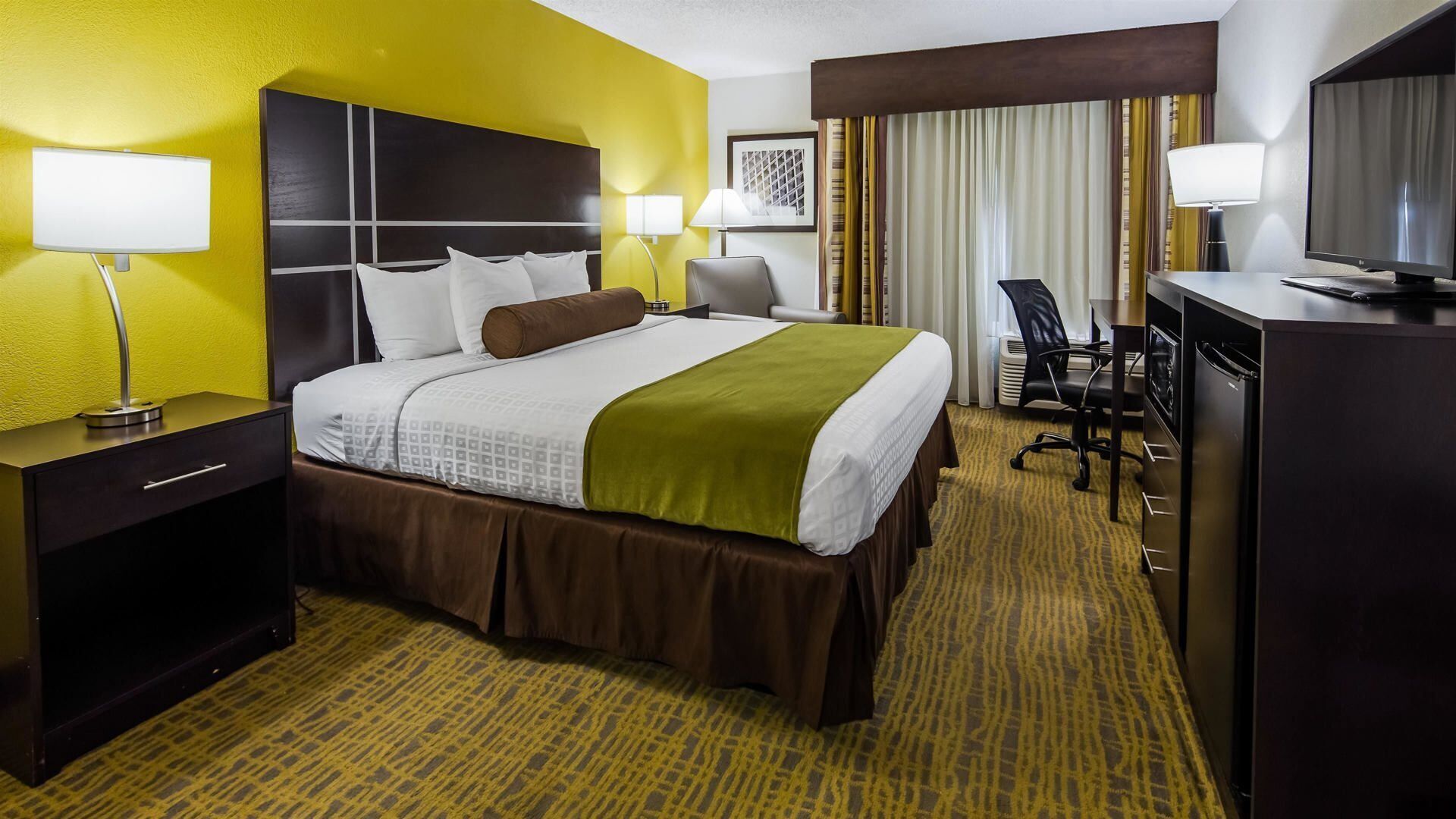 Premium bedding, desk, laptop workspace, soundproofing