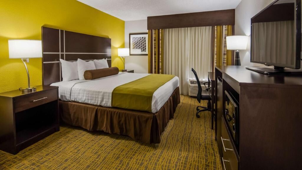 Premium bedding, desk, laptop workspace, soundproofing