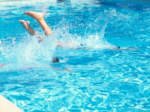 Seasonal outdoor pool, open 9:00 AM to 8:00 PM, free pool cabanas