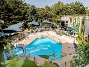 Seasonal outdoor pool, open 9:00 AM to 8:00 PM, free pool cabanas