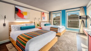 A hotel room with two beds, a large window, and a desk with a lamp. - Century Park Hotel (Los Angeles)