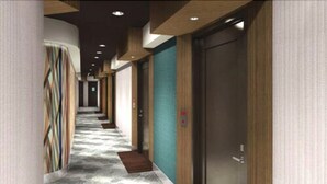 A modern hotel corridor with a patterned carpet, wooden paneling, and a series of doors. - Century Park Hotel (Los Angeles)