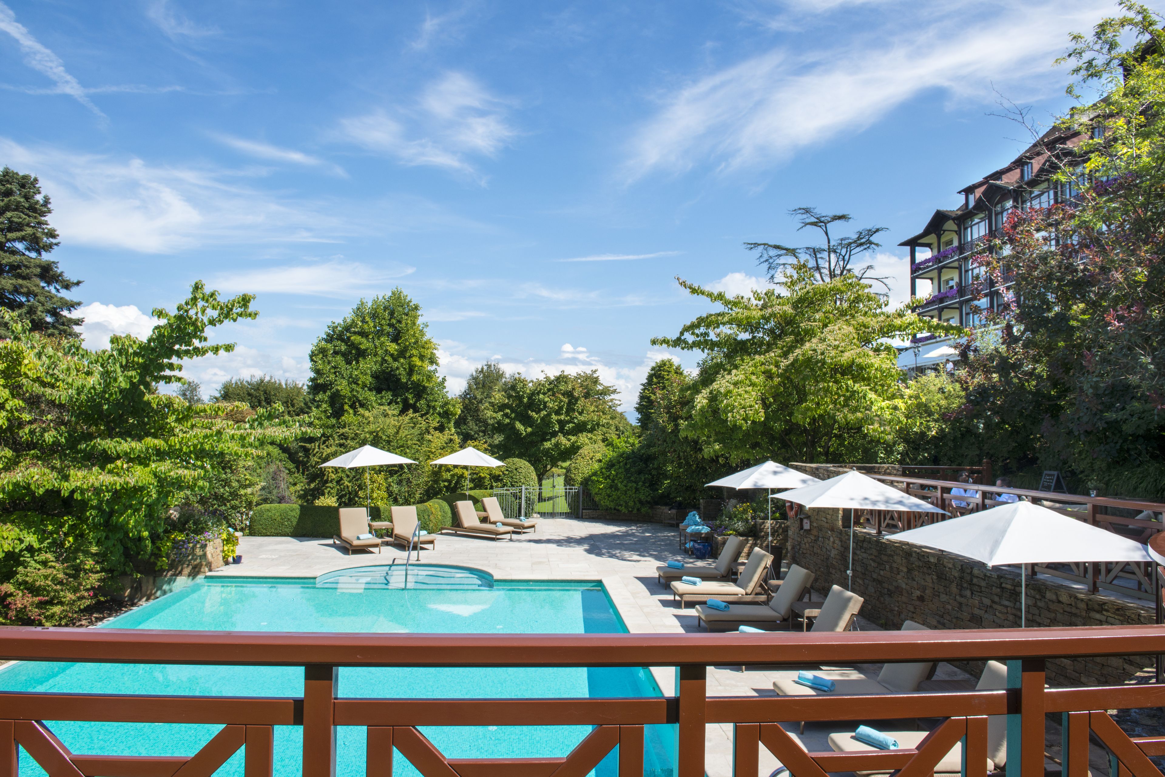 indoor pool, outdoor pool, pool umbrellas, pool loungers