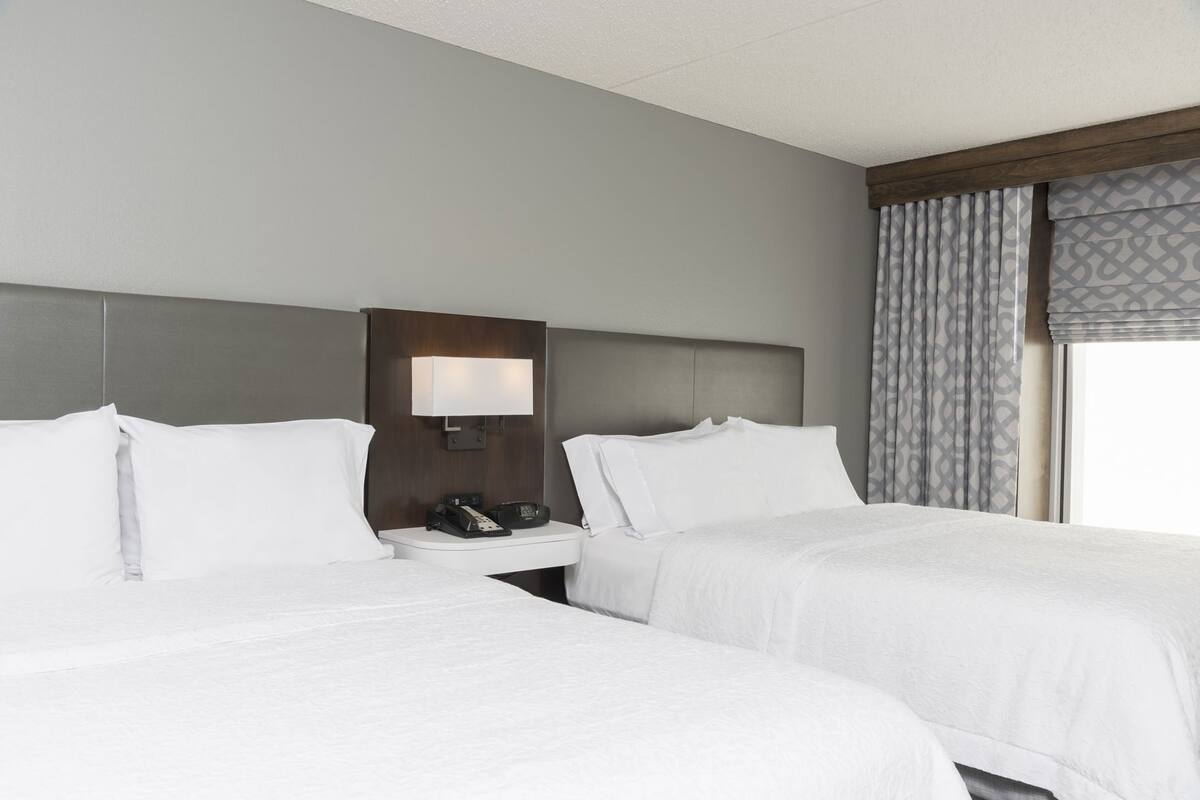 Hypo-allergenic bedding, desk, laptop workspace, blackout curtains