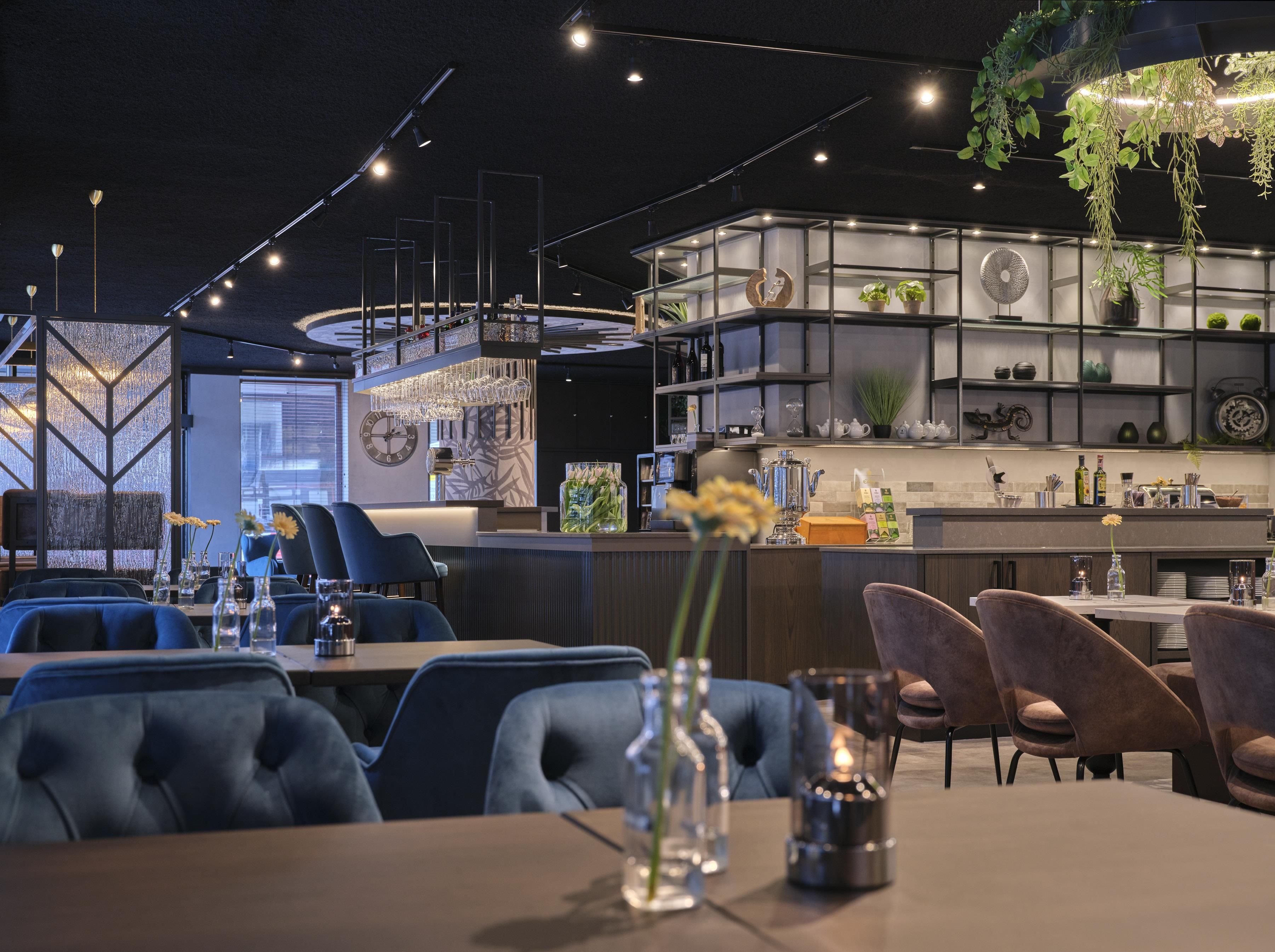 A modern dining area with a bar, seating, and decorative elements.