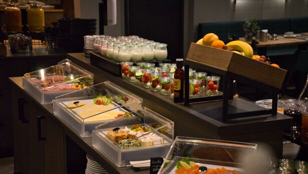 A buffet with various food options including meats, cheeses, and salads. - Best Western Plus Hotel Regence (Aachen)