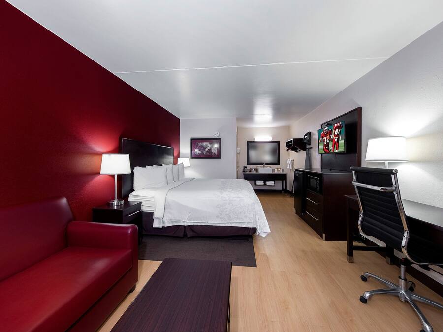 Desk, laptop workspace, blackout drapes, iron/ironing board