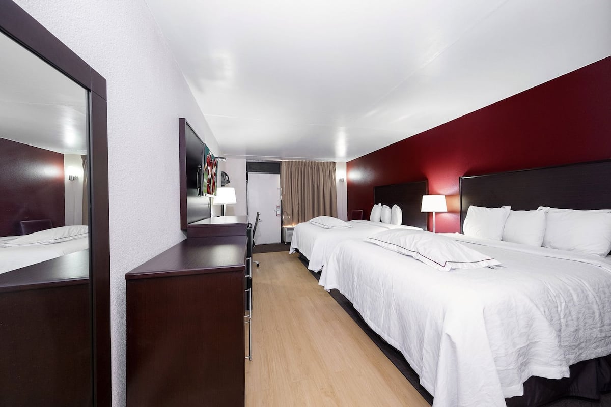 Desk, laptop workspace, blackout drapes, iron/ironing board