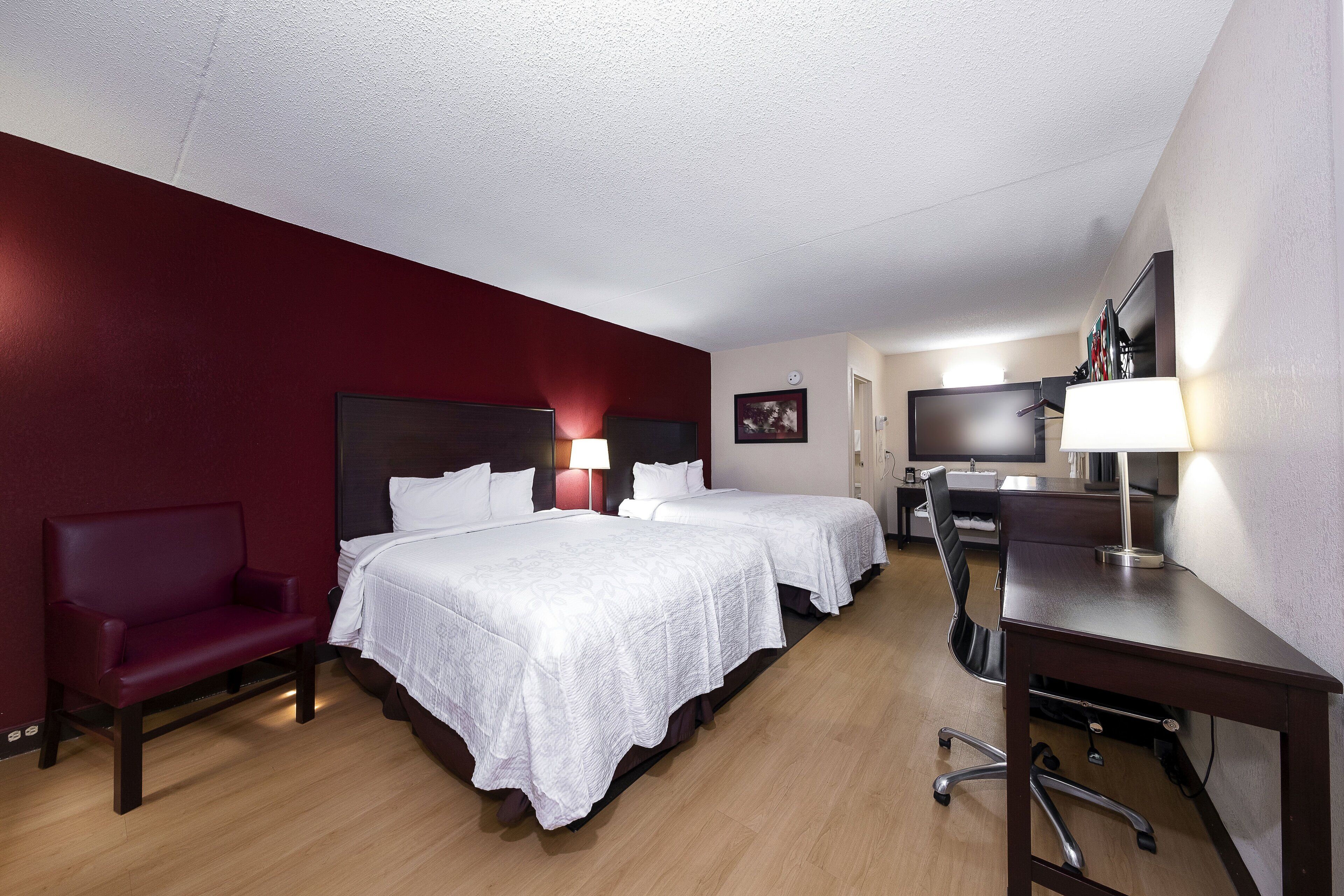 Premium Room, 2 Queen Beds (Upgraded Bedding & Snack, Smoke Free) | Desk, laptop workspace, blackout drapes, iron/ironing board