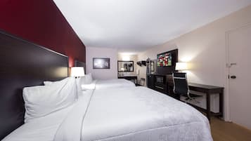 Deluxe Room, 2 Queen Beds (Smoke Free) | Desk, laptop workspace, blackout drapes, iron/ironing board