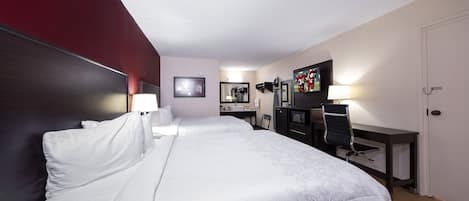 Deluxe Room, 2 Queen Beds (Smoke Free) | Desk, laptop workspace, blackout drapes, iron/ironing board
