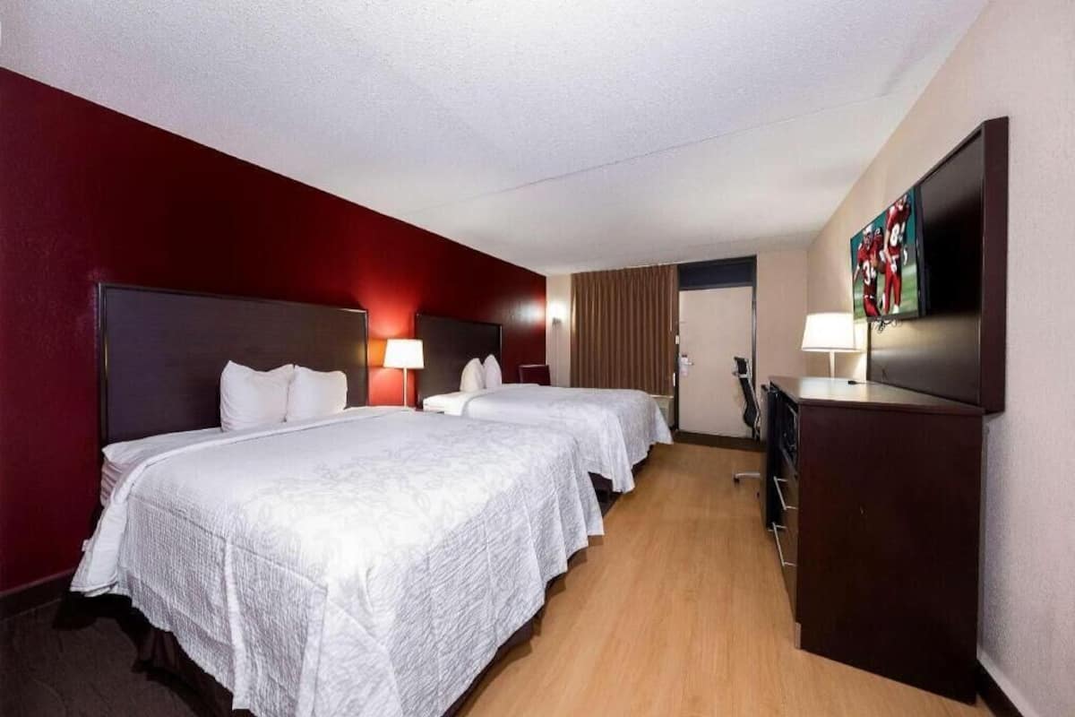 Desk, laptop workspace, blackout drapes, iron/ironing board